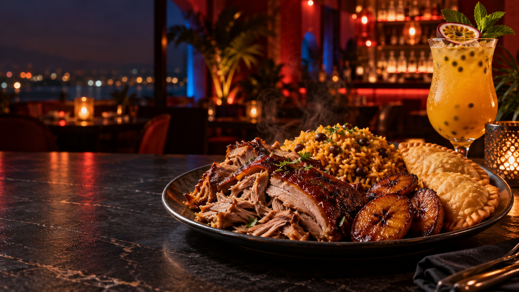 Puerto Rican pernil, arroz con gandules, maduros, empanadas and a passion-fruit cocktail on a restaurant table